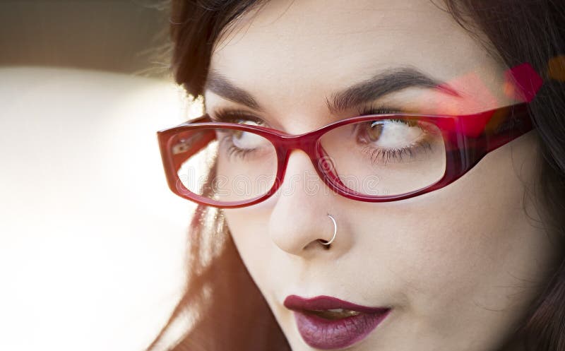 Close up of young beautiful traveler wearing reading glasses