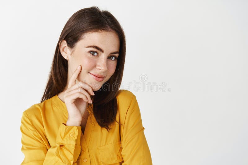 close-up-young-brunette-woman-looking-intrigued-camera-smiling-staring-knowing-look-standing-near-copy-space-223722578.jpg