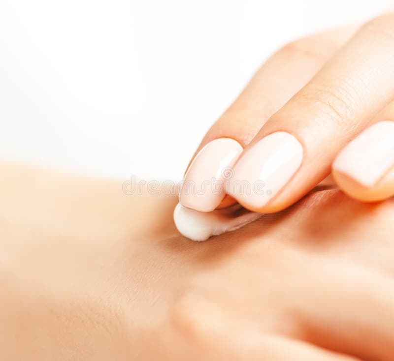 Close-up of female hands applying cream. stock image Close-up of female hands applying cream. stock image