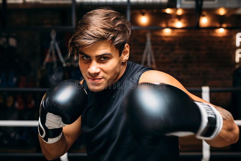 Close up of a young male boxer with boxing gloves royalty free stock images Close up of a young male boxer with boxing gloves royalty free stock images