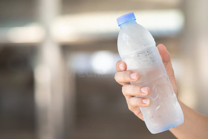 Close Up Young Man Hand Holding Fresh Drinking Cold Water Bottle