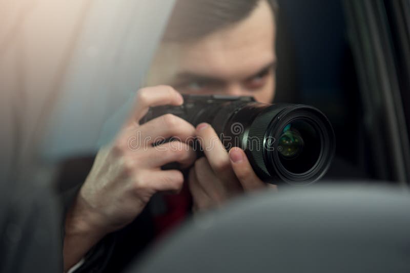 Close-up - Young Man Photorapher Sitting In The Car