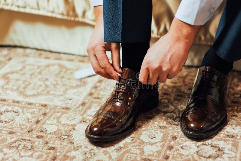 Close-up Young Man Tying Elegant Shoes Indoors Stock Photo - Image of ...