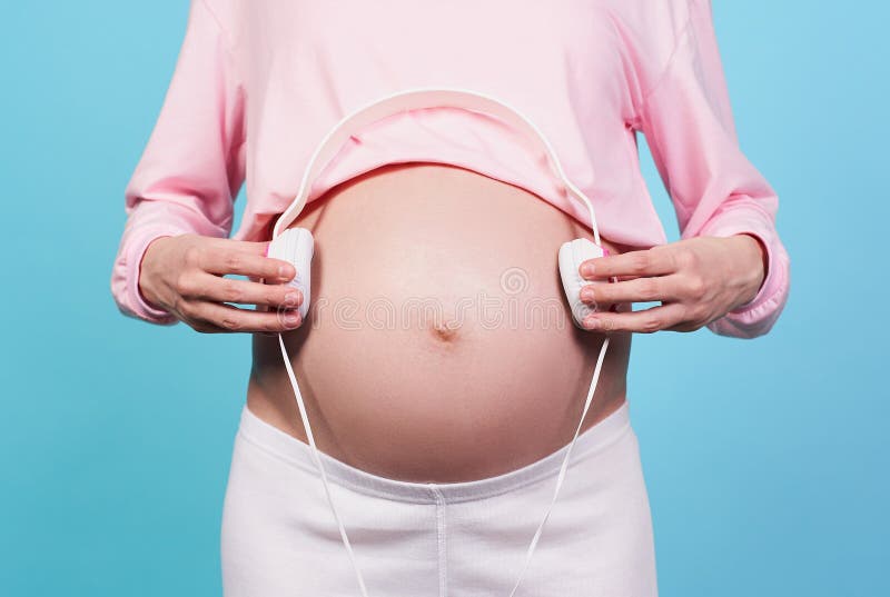 Melodies Womb Headphones Placed On Pregnant Stock Photo 2363589935