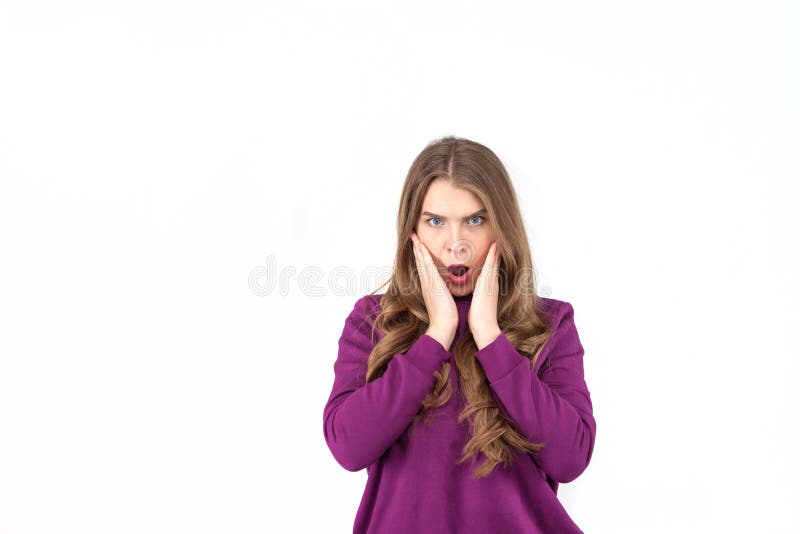 Close up of young woman who is shocked, surprised and astonished. Human facial expressions and emotions. White background. royalty free stock image Close up of young woman who is shocked, surprised and astonished. Human facial expressions and emotions. White background. royalty free stock image