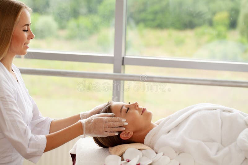 Close Up Of Young Woman Getting Spa Massage Treatment At Beauty Spa