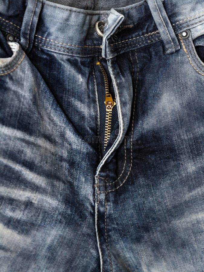 Close-up zipper open on blue shabby jeans, denim texture, zipper jeans pants stock image Close-up zipper open on blue shabby jeans, denim texture, zipper jeans pants stock image