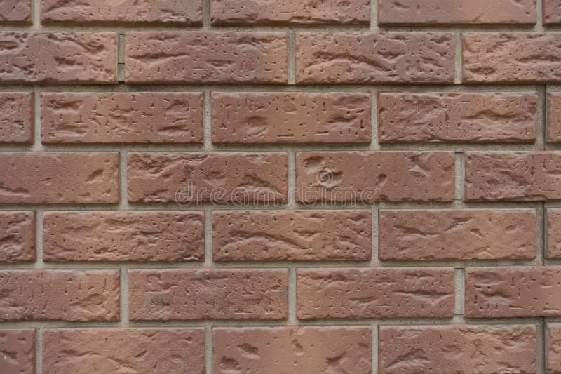 Close View of Brown Brick Veneer Wall with Grey Mortar Joints Stock