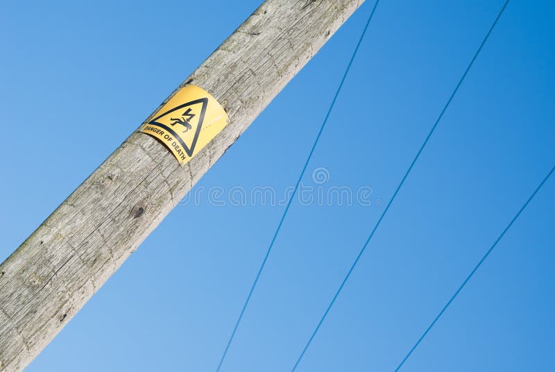 Close view of Danger sign on electricity pole