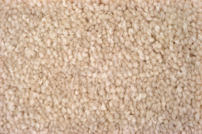Close view of plush tan carpeting stock photo