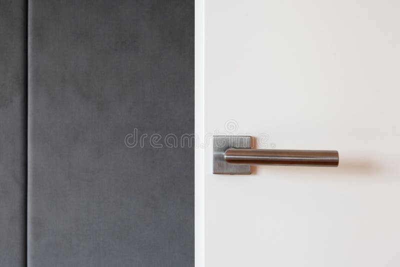 Close white door with metallic handle stock images