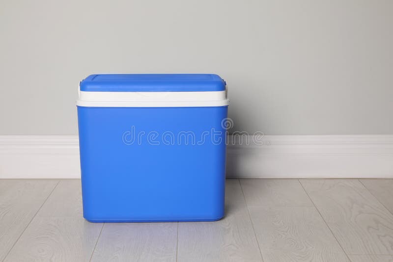 Closed Blue Plastic Cool Box Near Light Grey Wall Indoors. Space for Text Stock Image Image of