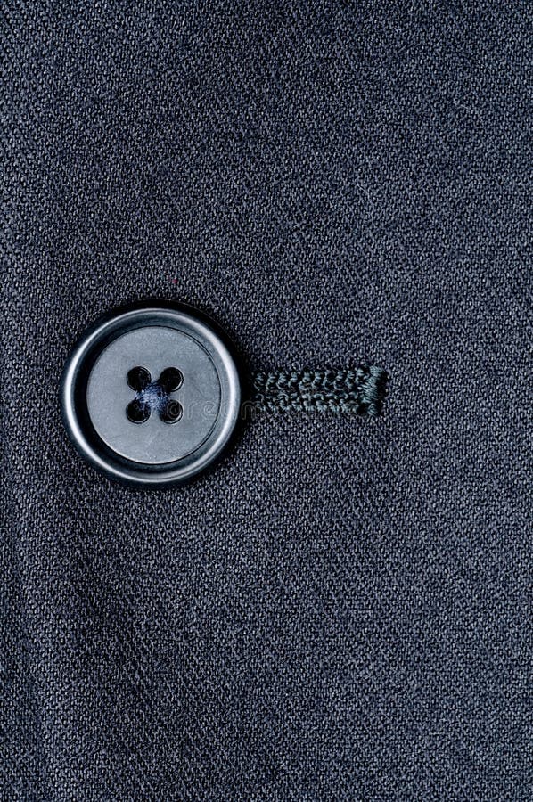 Close-up of a closed button on a suit jacket