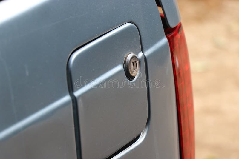 Closed Fuel Tank of a Car with Old Locking System and a Side View of Brake Lights Stock Photo