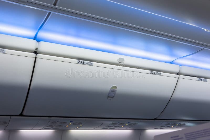 Closed Luggage Racks for Hand Luggage in an Airplane Stock Photo