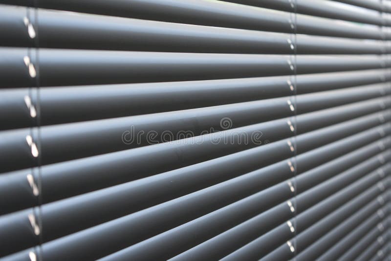 Closed metal blinds, sunlight reflection royalty free stock image Closed metal blinds, sunlight reflection royalty free stock image