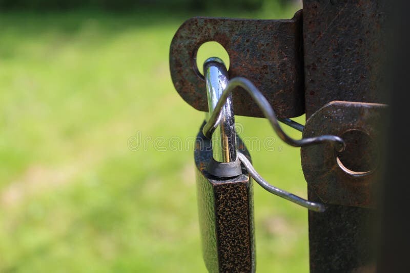Closed Metal Lock on Iron Gates, Doors Stock Photo - Image of outside ...