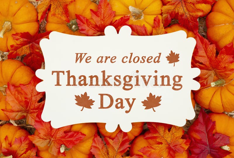 We are Closed Thanksgiving Day Sign on a Metal Sign on Pumpkins Stock