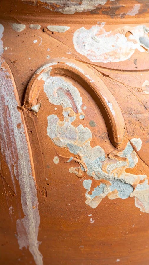 Closeup of Aged Brown Pottery with White Paint Flaking stock illustration