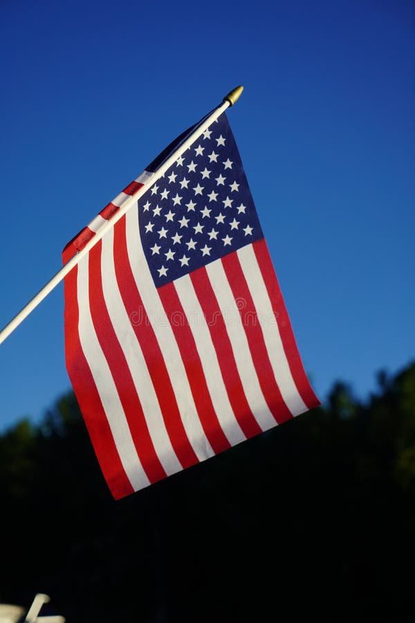 Closeup of the American flag on a blue blurred background stock photography Closeup of the American flag on a blue blurred background stock photography