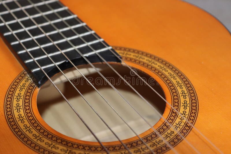 Closeup of classic acoustic guitar strings and fret board stock photos Closeup of classic acoustic guitar strings and fret board stock photos