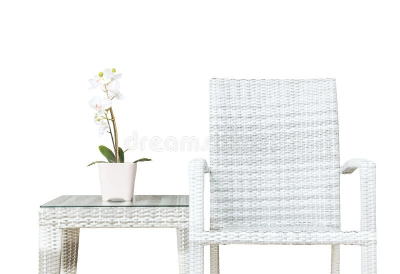 Closeup artificial plant with white orchid flower on pink flower pot on wood weave table with wood weave chair isolated on white