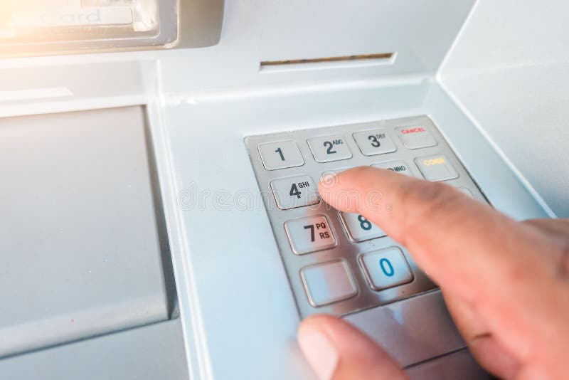 Closeup ATM machine and finger hand entering pressing password for withdrawing money banknotes stock photos Closeup ATM machine and finger hand entering pressing password for withdrawing money banknotes stock photos