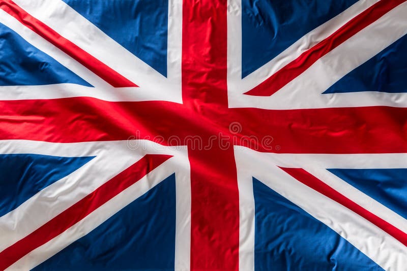 Closeup of Union Jack flag. UK Flag. British Union Jack flag blowing in the wind. Closeup of Union Jack flag. UK Flag. British Union Jack flag blowing in the wind