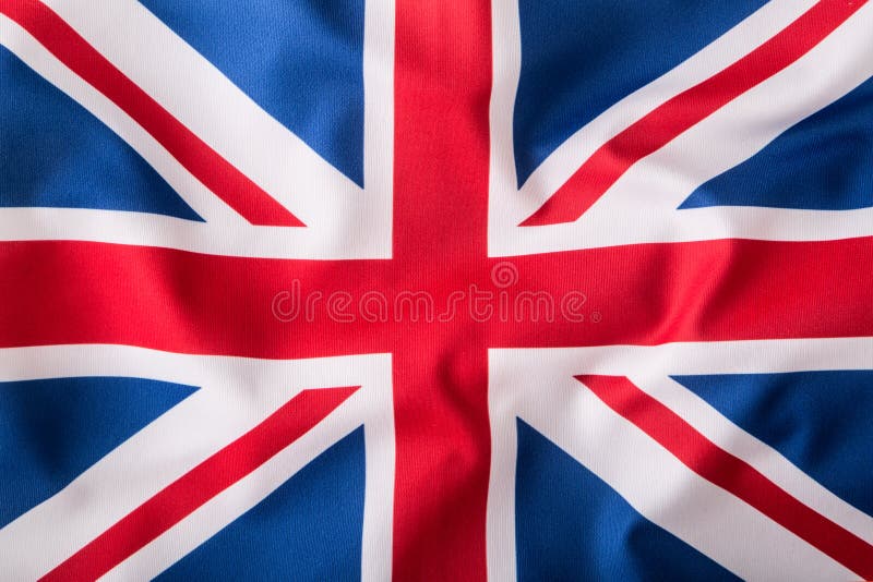 Closeup of Union Jack flag. UK Flag. British Union Jack flag blowing in the wind. Closeup of Union Jack flag. UK Flag. British Union Jack flag blowing in the wind.