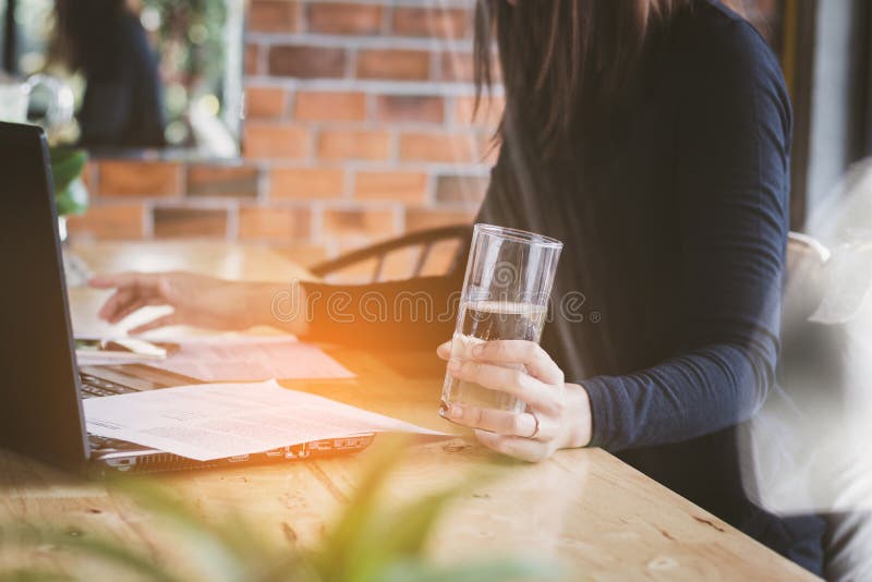 Asia business woman working,drinking water with relax,fun and happy in office. royalty free stock image Asia business woman working,drinking water with relax,fun and happy in office. royalty free stock image