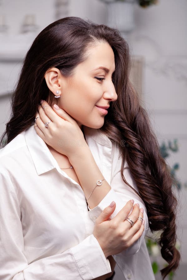 Closeup Beautiful Brunette Girl with Long Hair in Silver Jewelry Earrings, Rings, Bracelet, Chain, Necklace. Сoncept Shooting Stock Photo - Image of beauty, lifestyle: 141565046 Closeup Beautiful Brunette Girl with Long Hair in Silver Jewelry Earrings, Rings, Bracelet, Chain, Necklace. Сoncept Shooting Stock Photo - Image of beauty, lifestyle: 141565046