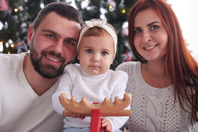 Beautiful Christmas portrait of young family royalty free stock photo Beautiful Christmas portrait of young family royalty free stock photo