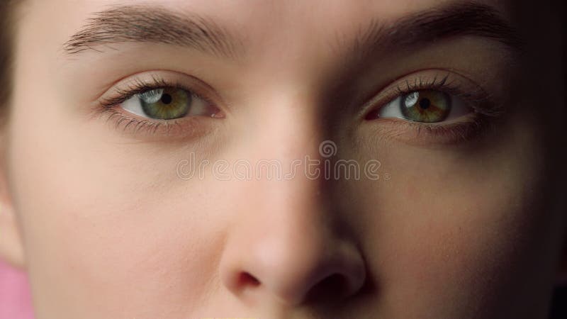 Closeup beautiful female face with closed eyes. Serious young woman face