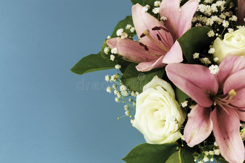 Closeup beautiful flowers in pastel colors on a blue background in vintage processing. Greeting card, mom`s day, wedding royalty free stock photos Closeup beautiful flowers in pastel colors on a blue background in vintage processing. Greeting card, mom`s day, wedding royalty free stock photos