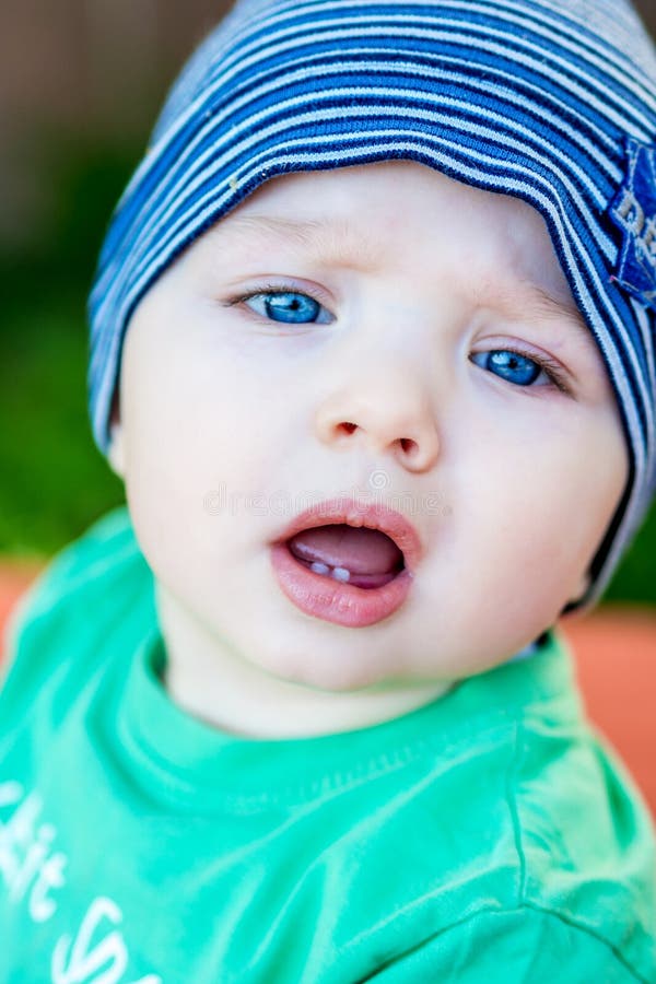 Closeup Of Beautiful Happy Baby With Blue Eyes Stock Photo Image Of