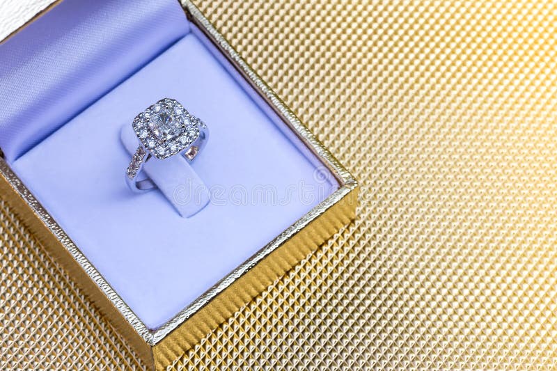 Closeup Beautiful and Luxury Wedding Diamond Ring in Box on Gold
