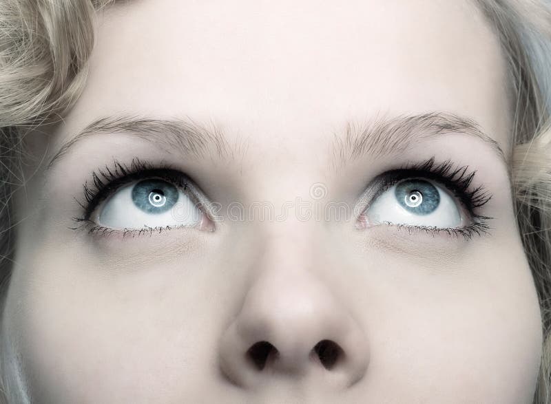 Closeup of a beautiful woman looking up