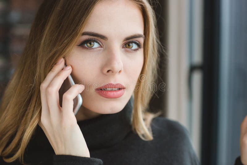 Closeup of beautiful woman talking on cell phone stock images