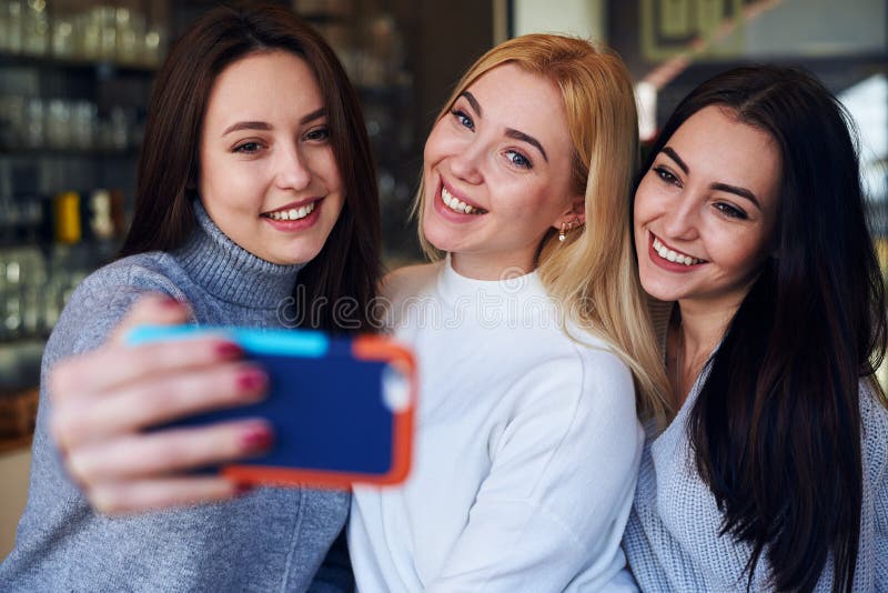 Best friends making selfie at cafe on daytime royalty free stock photo Best friends making selfie at cafe on daytime royalty free stock photo