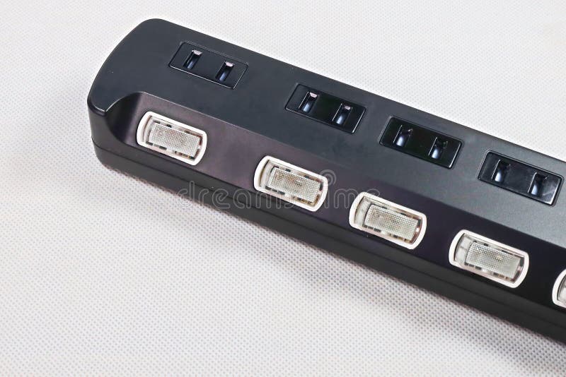 Closeup of a black electrical power bar white background stock images