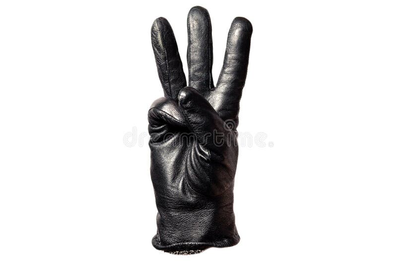 Close-up black leather glove, fingers showing number three. Isolated on white background. Concept symbols, signs, numbers
