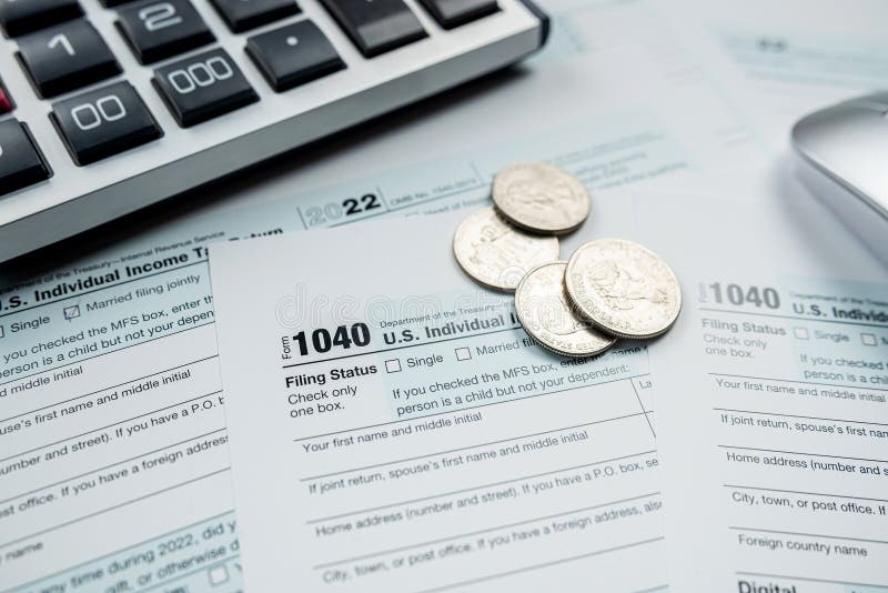 Closeup blank Tax return form 1040 with us coin cent stock photos