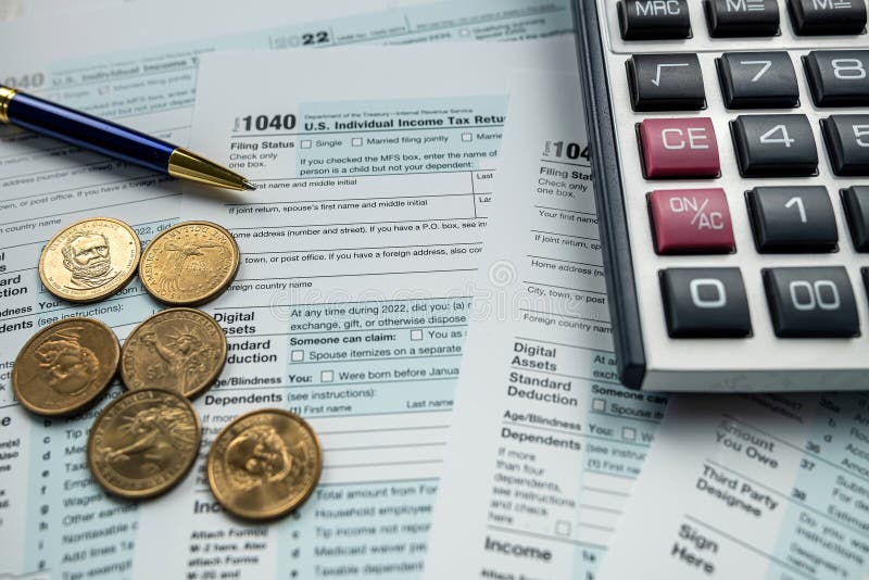Closeup blank Tax return form 1040 with us coin cent stock photos