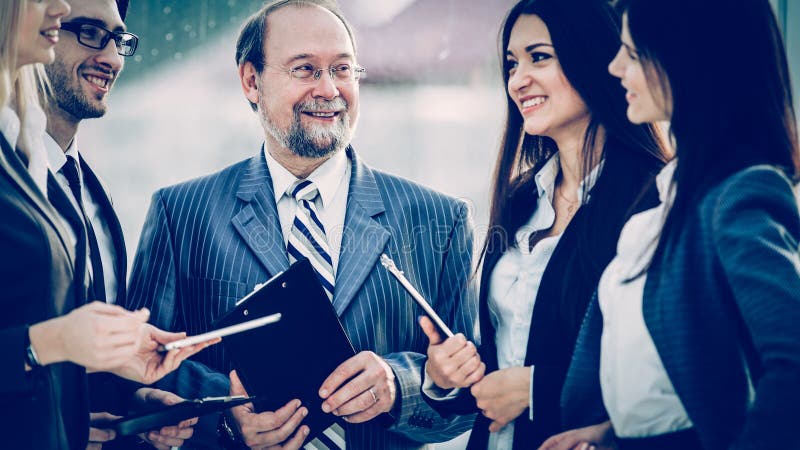 Closeup of the boss and business team on office background royalty free stock photography Closeup of the boss and business team on office background royalty free stock photography