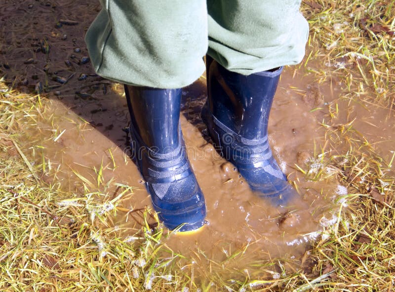 Closeup of Boy in Blue Rain Boots Splashing in a Muddy Puddle Af Stock ...