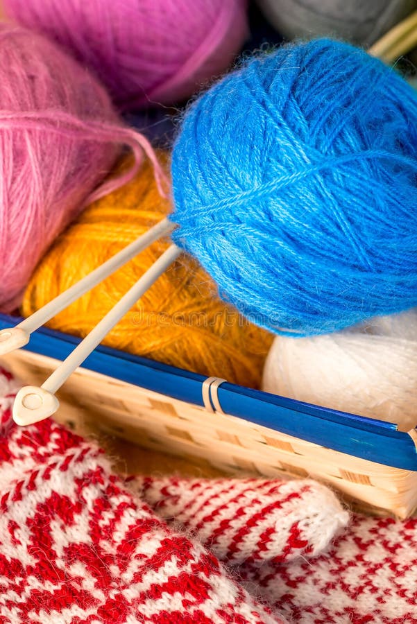 Bright Red Wool Thick Thread with a Sewing Needle Lies in the Shape of