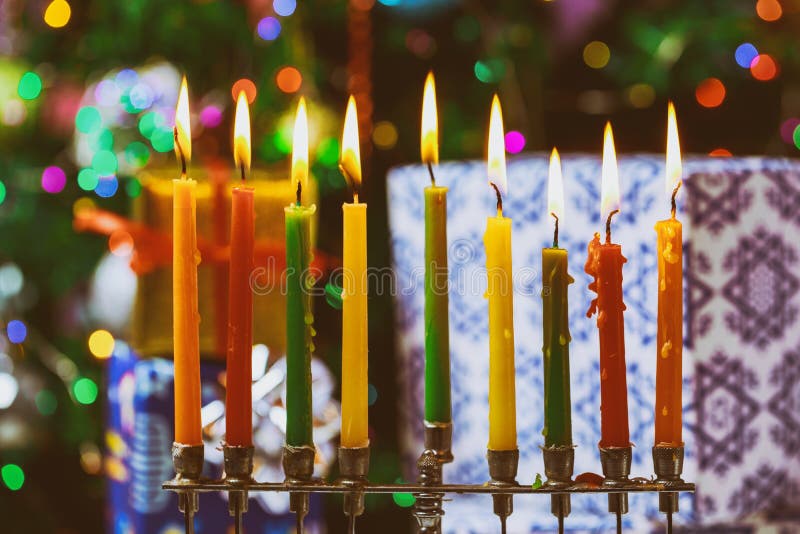 Closeup of a burning Chanukah candlestick with candles Menorah. A traditional Jewish holiday, hanukkah, hanukkiah, religion, celebration, judaism, symbol stock image Closeup of a burning Chanukah candlestick with candles Menorah. A traditional Jewish holiday, hanukkah, hanukkiah, religion, celebration, judaism, symbol stock image