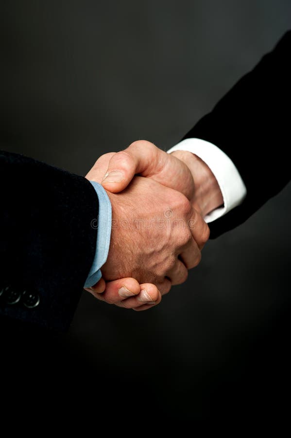 Closeup of a business handshake stock photo Closeup of a business handshake stock photo