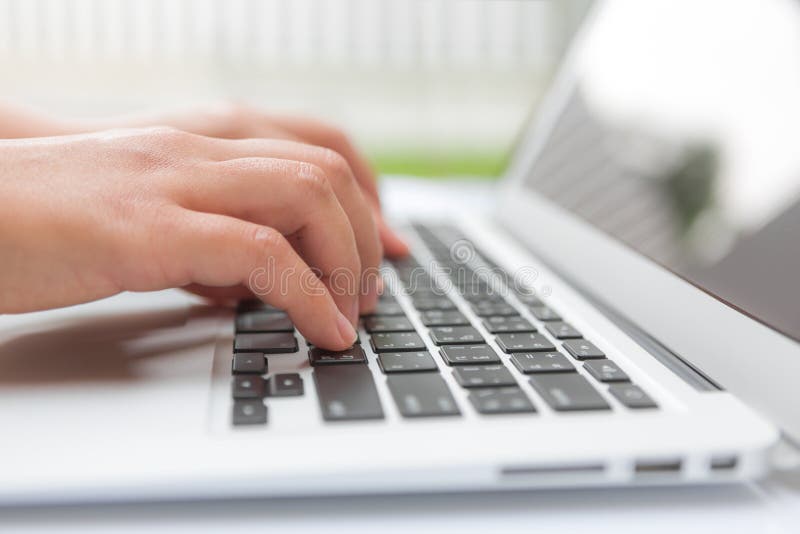 Closeup of business woman hand typing