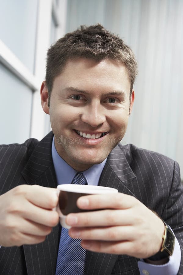 Closeup of a Businessman with Coffee Cup Stock Image Image of indoors